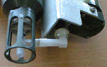 Rotate T guard into position; insert T duct into tubing